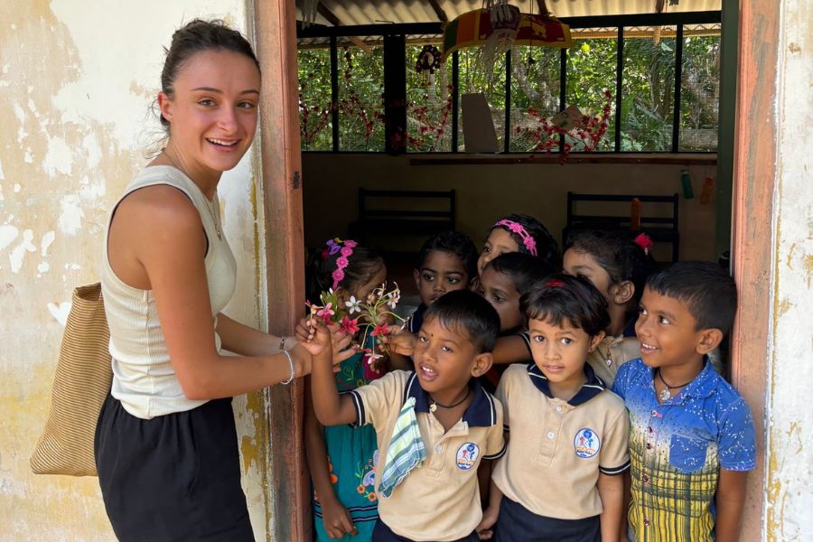 Volunteers and children at a school in the Galle area